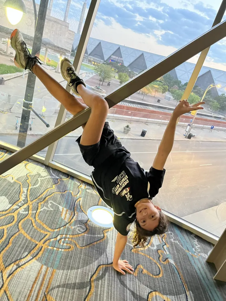 Ruby mid-cartwheel indoors