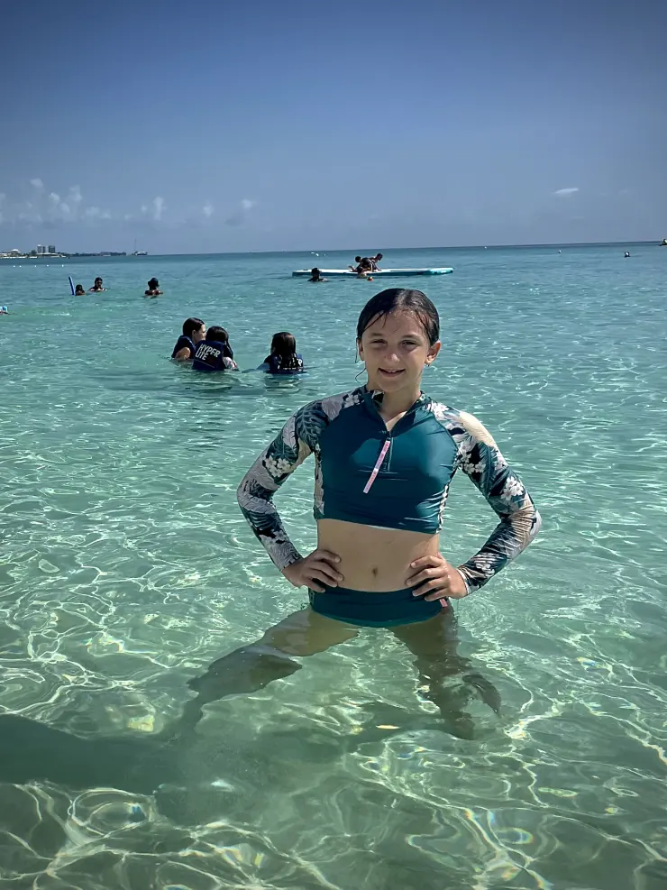 Ruby standing in clear turquoise sea water