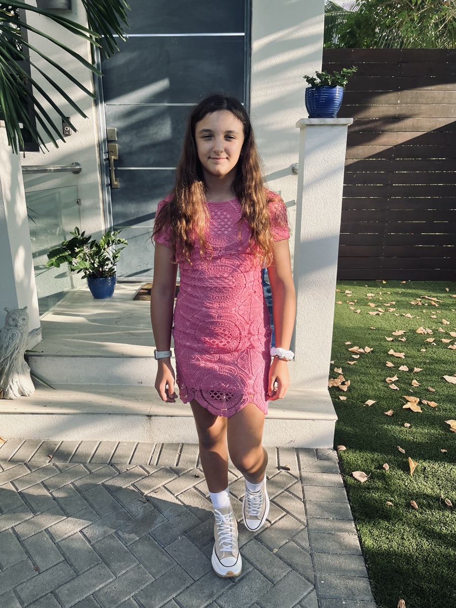 Ruby in a pink dress outside