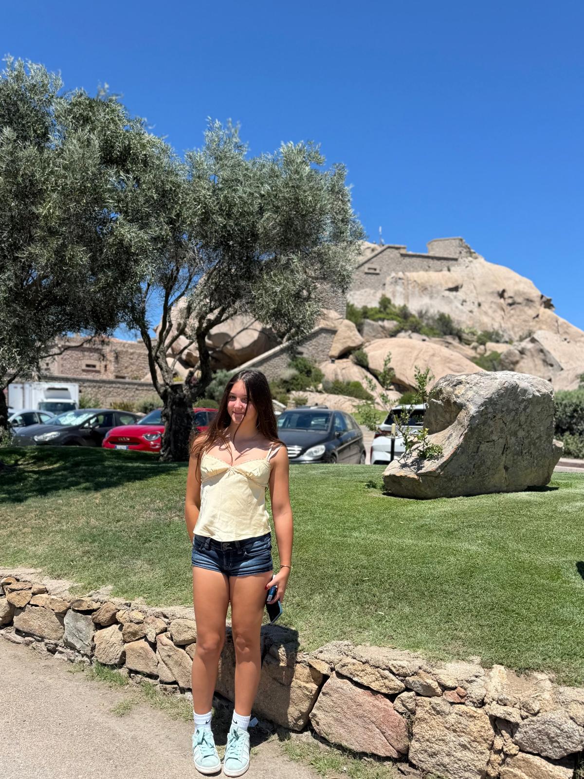 Ruby below a rocky citadel on a hill in Sardinia
