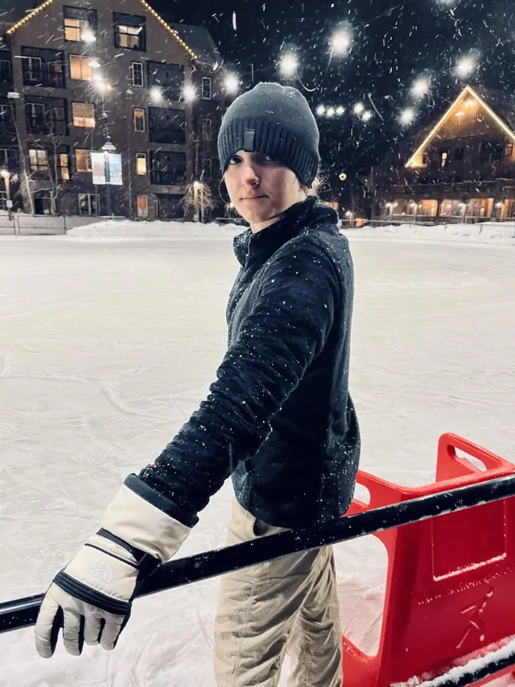 Ruby on the ice rink in falling snow